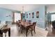 Bright dining room with natural light from the window at 112 Smith Rock Dr, Holly Springs, NC 27540