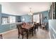 Elegant dining room with seating for eight, natural light at 112 Smith Rock Dr, Holly Springs, NC 27540