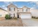 Charming two-story home with attached two-car garage at 112 Smith Rock Dr, Holly Springs, NC 27540