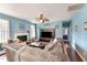 Spacious living room with fireplace and large sectional sofa at 112 Smith Rock Dr, Holly Springs, NC 27540