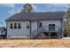 Rear view of house showing deck and landscaping at 124 Sequoia Dr, Louisburg, NC 27549