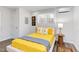 Bright bedroom with a yellow comforter and modern decor at 1309 Hudson Ave # D11, Durham, NC 27705