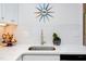 White kitchen with subway tile backsplash and modern sink at 1309 Hudson Ave # D11, Durham, NC 27705