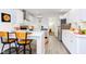 Open concept kitchen with island and breakfast bar at 1309 Hudson Ave # D11, Durham, NC 27705