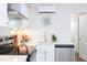 Modern kitchen with white cabinets, stainless steel appliances at 1309 Hudson Ave # D11, Durham, NC 27705