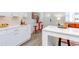 Open concept kitchen with island and white cabinets at 1309 Hudson Ave # D11, Durham, NC 27705