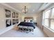 Spacious bedroom with large window and decorative wall art at 1404 Hollyview Ave, Durham, NC 27703