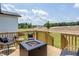 Relaxing back deck with a modern fire pit and beautiful view of the community at 15 Rosedale Way, Pittsboro, NC 27312