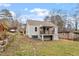 Spacious backyard showcasing the home's exterior, porch, and landscaping at 1606 James St, Durham, NC 27707