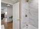 Elegant bathroom featuring marble tile and a bathtub at 1606 James St, Durham, NC 27707