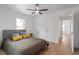 Bright bedroom with wood floors and a ceiling fan at 1606 James St, Durham, NC 27707