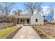 Charming single-story home with gray siding, inviting front porch, and landscaped front yard at 1606 James St, Durham, NC 27707