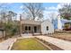 Attractive home exterior with a inviting front porch, manicured landscaping, and stone pathway at 1606 James St, Durham, NC 27707