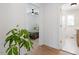 Bright hallway with wood floors, leading to bedroom and bathroom at 1606 James St, Durham, NC 27707