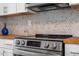 Stainless steel range with modern controls in updated kitchen at 1606 James St, Durham, NC 27707
