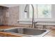 Modern kitchen sink and faucet with hexagon tile backsplash at 1606 James St, Durham, NC 27707