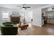 Bright living room with fireplace, hardwood floors, stylish furnishings, and an open floor plan at 1606 James St, Durham, NC 27707