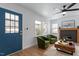 Bright living room featuring a ceiling fan, fireplace, hardwood floors, and stylish furnishings at 1606 James St, Durham, NC 27707