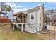 Exterior rear view showcasing porch, steps, and home's architectural details at 1606 James St, Durham, NC 27707