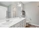 Modern bathroom with double vanity and large mirror at 165 Turlington Rd, Dunn, NC 28334