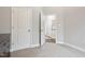 Spacious bedroom with carpet flooring and access to hallway at 165 Turlington Rd, Dunn, NC 28334