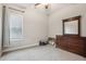 Bright bedroom with carpeted floor, large dresser, and ceiling fan at 165 Turlington Rd, Dunn, NC 28334