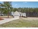 House exterior with a long driveway and surrounding trees at 165 Turlington Rd, Dunn, NC 28334
