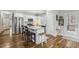 Modern kitchen with white cabinets, granite countertops, and stainless steel appliances at 165 Turlington Rd, Dunn, NC 28334