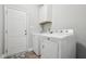 Convenient laundry room with washer, dryer, and built-in cabinets at 165 Turlington Rd, Dunn, NC 28334