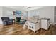 Spacious living room with hardwood floors, fireplace, and large sectional sofa at 165 Turlington Rd, Dunn, NC 28334