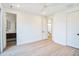 Bedroom with hardwood floors and access to a hallway bathroom at 2119 Brewer St, Raleigh, NC 27608