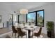 Bright dining room with large windows and modern light fixture at 2119 Brewer St, Raleigh, NC 27608