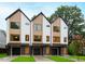Three modern townhouses with attached garages and manicured lawns at 2119 Brewer St, Raleigh, NC 27608