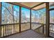 Screened porch with wood flooring and treetop views at 2119 Brewer St, Raleigh, NC 27608