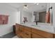 Modern bathroom with double sinks and hexagon tile floor at 2201 Millbank Village Ct # 101, Raleigh, NC 27610