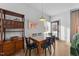 Charming dining area features a mid-century modern table and four black chairs at 2201 Millbank Village Ct # 101, Raleigh, NC 27610