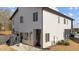 Modern exterior with light-colored siding and private patio at 2201 Millbank Village Ct # 101, Raleigh, NC 27610