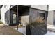 Modern front entrance with a black door and planter at 2201 Millbank Village Ct # 101, Raleigh, NC 27610