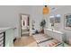 Bright hallway with access to bedrooms and a view of a bedroom at 2201 Millbank Village Ct # 101, Raleigh, NC 27610