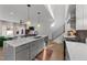 Open concept kitchen boasts modern cabinetry, breakfast bar, and stainless steel appliances at 2201 Millbank Village Ct # 101, Raleigh, NC 27610