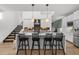 Modern kitchen with an island and breakfast bar at 2201 Millbank Village Ct # 101, Raleigh, NC 27610