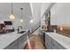 Modern kitchen features stainless steel appliances and an island with quartz countertops at 2201 Millbank Village Ct # 101, Raleigh, NC 27610