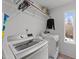 Convenient laundry room with LG washer and dryer and overhead shelving at 2201 Millbank Village Ct # 101, Raleigh, NC 27610