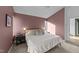 Spacious main bedroom with large bed and window views at 2201 Millbank Village Ct # 101, Raleigh, NC 27610