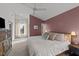 Spacious main bedroom with large bed and window views at 2201 Millbank Village Ct # 101, Raleigh, NC 27610