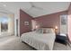 Spacious main bedroom with large bed and window views at 2201 Millbank Village Ct # 101, Raleigh, NC 27610