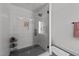 Large walk-in shower with glass enclosure and hexagon tile at 2201 Millbank Village Ct # 101, Raleigh, NC 27610