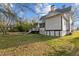 Spacious backyard with a well-maintained lawn and a deck, great for relaxation and recreation at 228 S Fayetteville St, Liberty, NC 27298