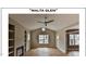 Spacious living room with hardwood floors, built-in shelves, and fireplace at 2930 Forest Creek Ln, Mebane, NC 27302