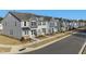 Row of townhouses with gray siding and attached garages at 316 Church St # 38, Wendell, NC 27591
